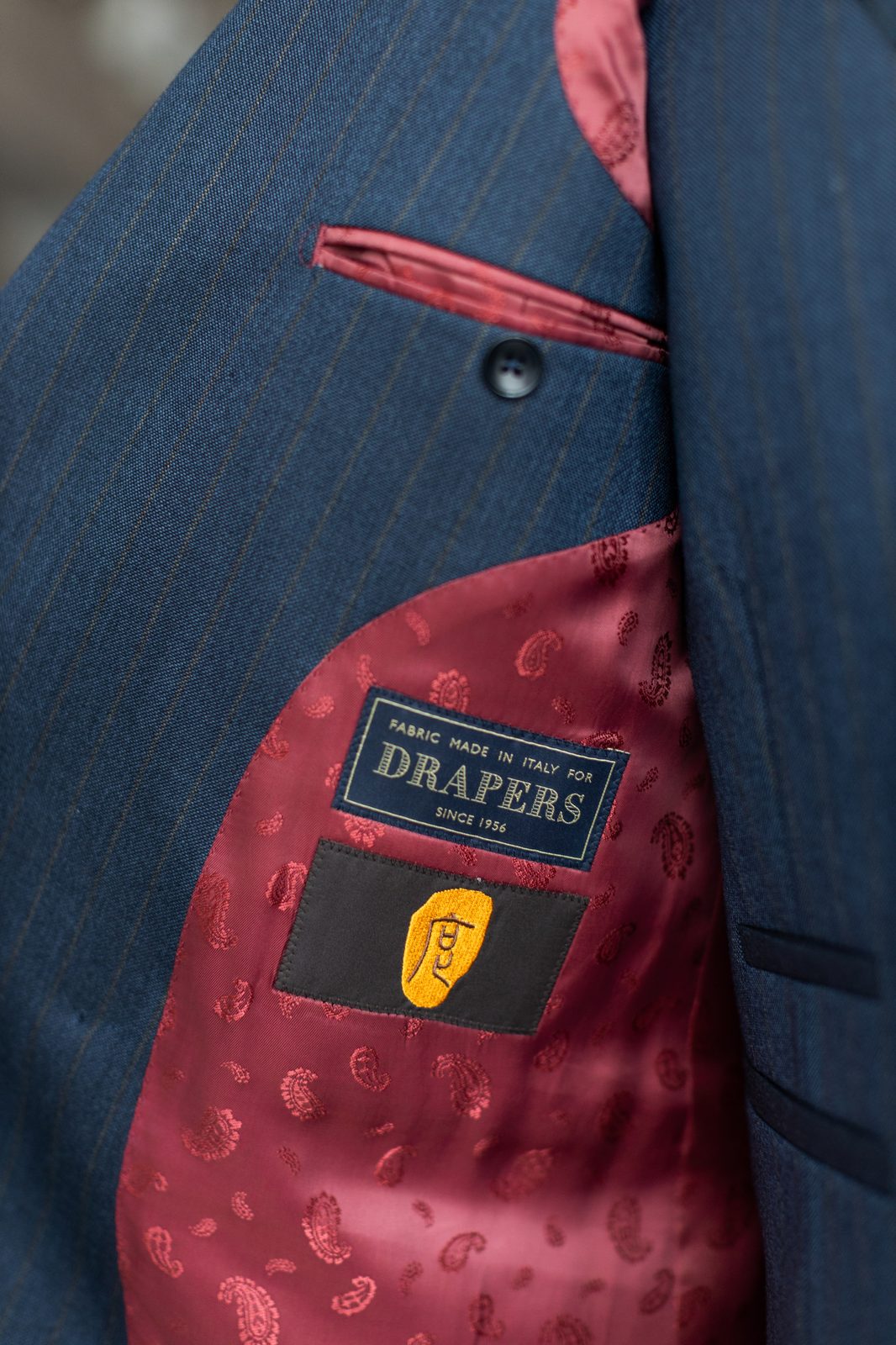 DRAPERS mill label with gold-thread 度 embroidery inside a 度·BESPOKE garment